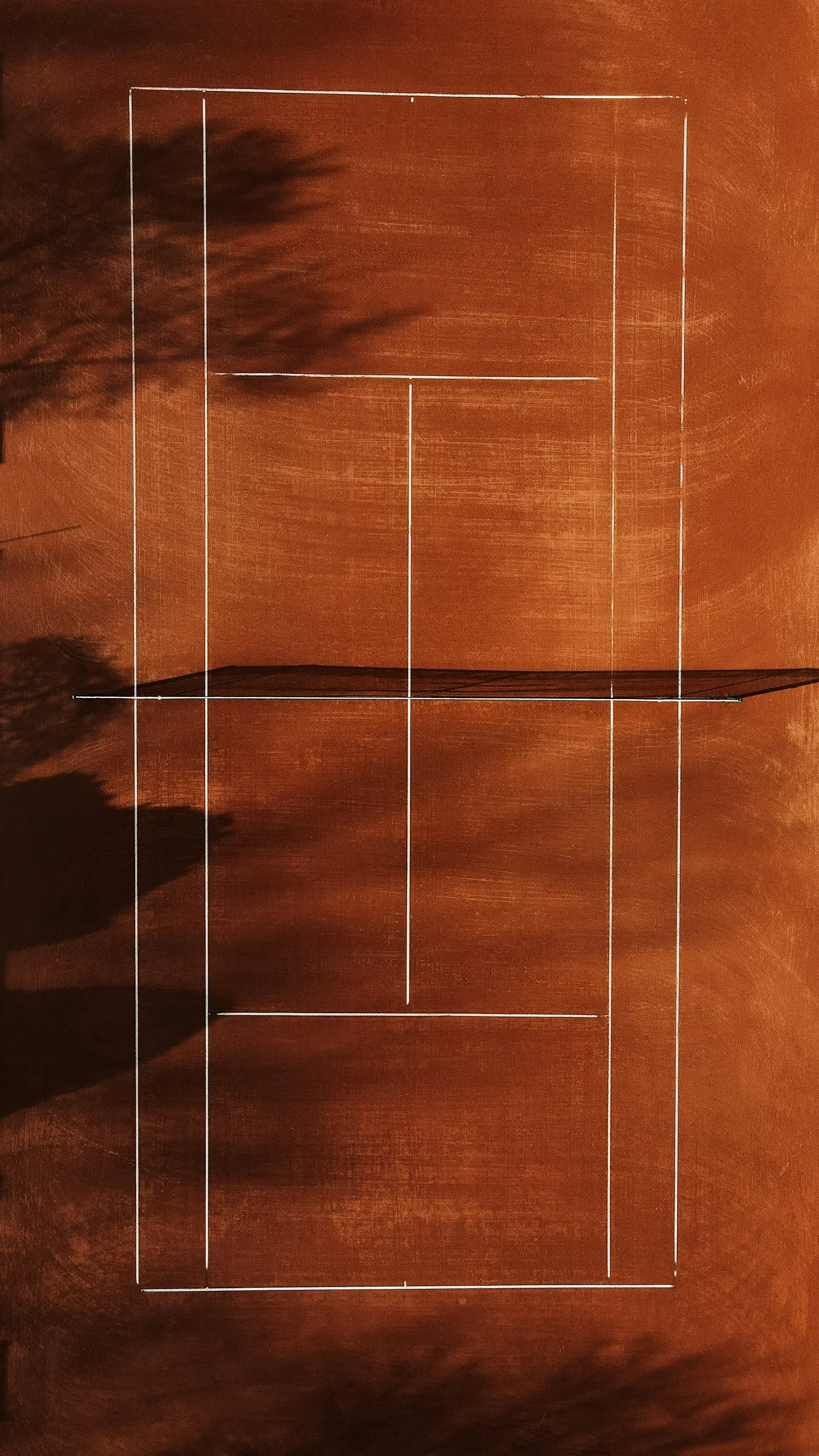 The clay court at NextPoint, shot from directly above — freshly swept lines
