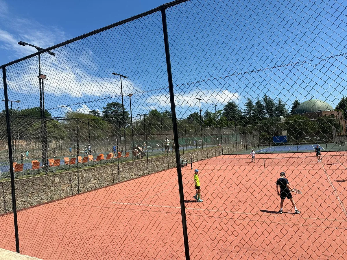 Juniors rallying on the clay court at NextPoint