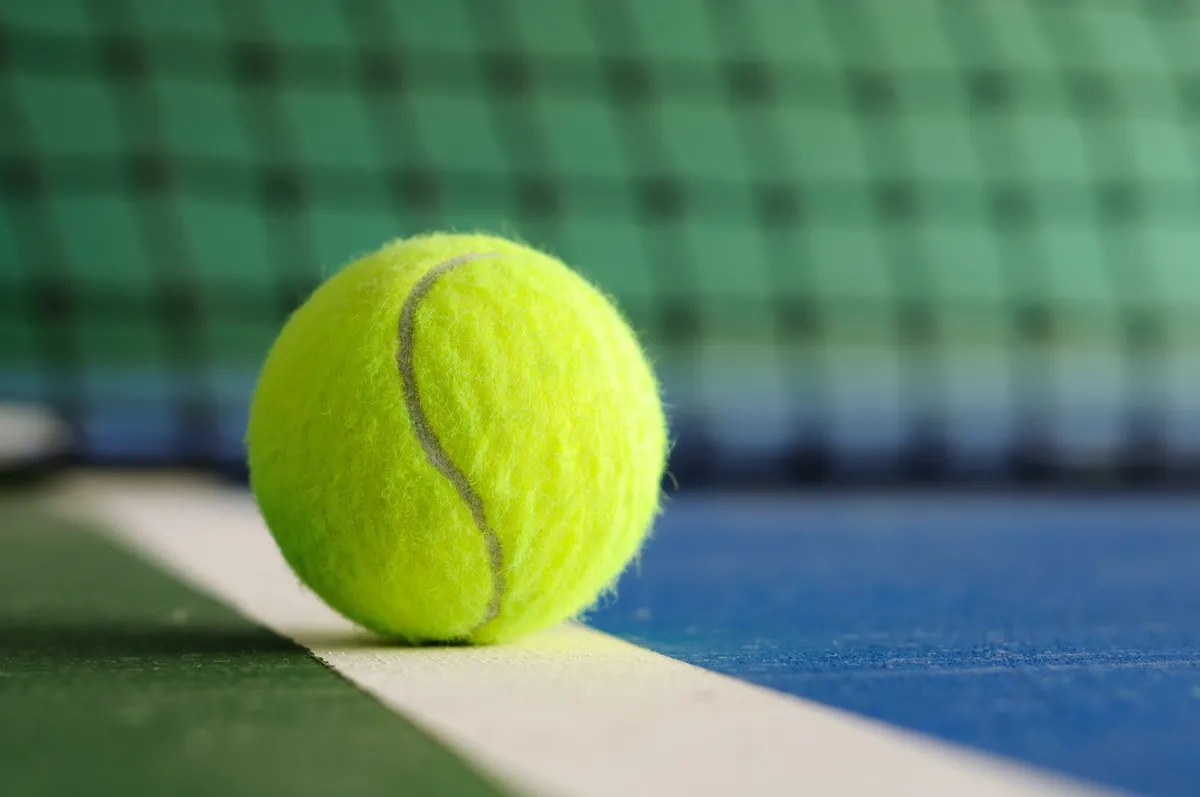 A ball waiting at the net cord, up close
